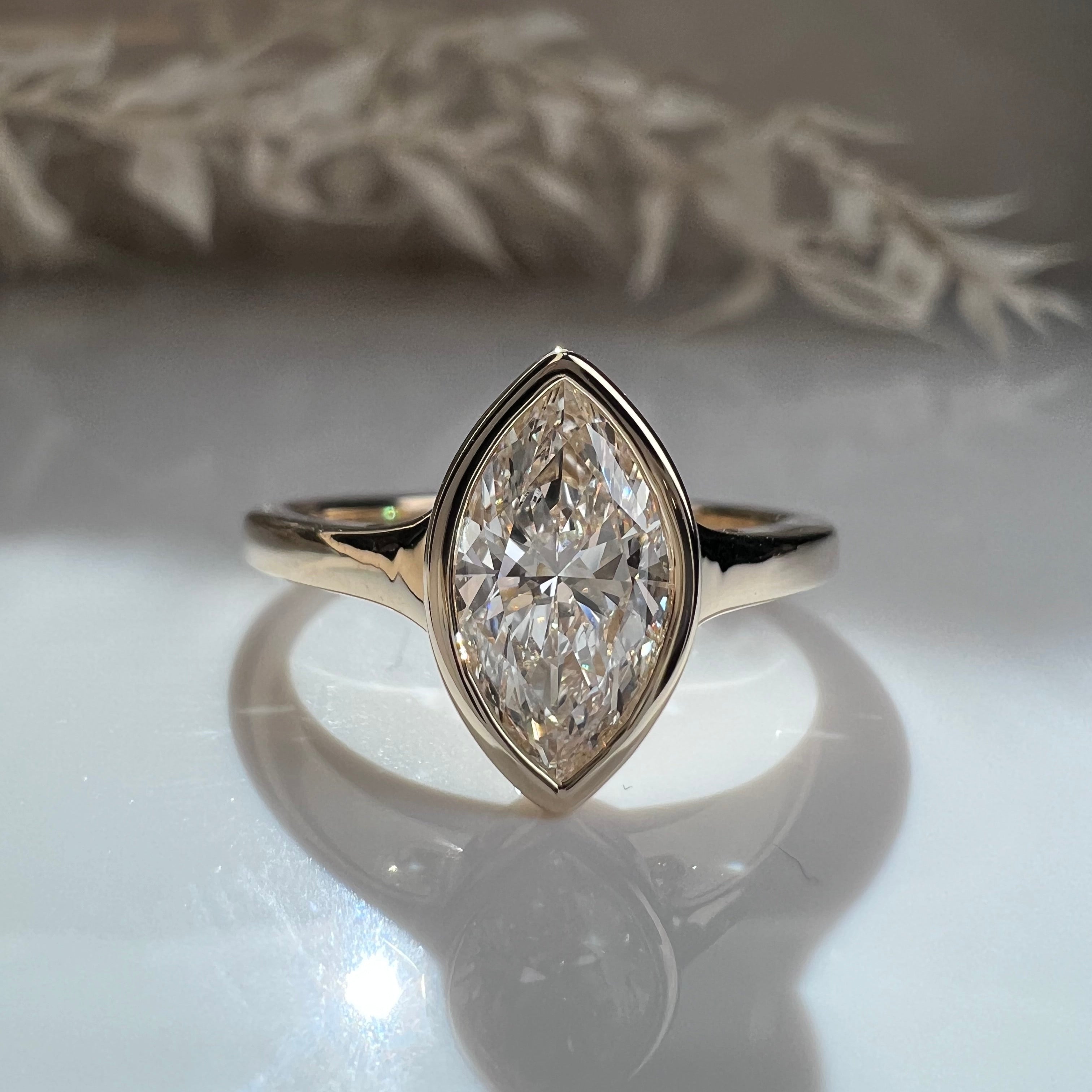 bezel set marquise yellow gold engagement ring